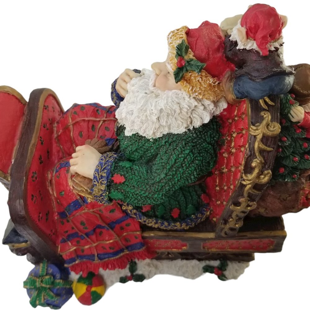 Santa in a Red Sleight Bed Resin Holiday Décor with Elves, Presents, And Toys - Picture 12 of 15